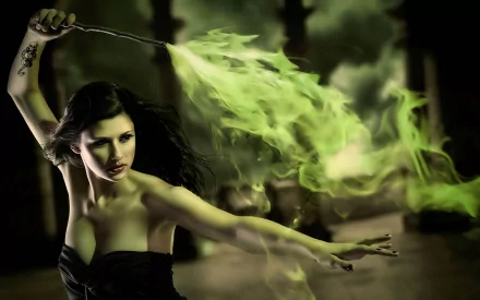 HD desktop wallpaper of a scene from a Harry Potter movie, featuring a woman wielding a wand emitting a swirling green spell, set against a mystical, dark background.