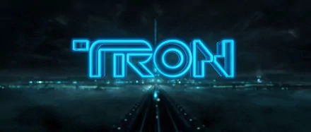 HD PC desktop wallpaper featuring the glowing blue TRON logo from the Disney movie TRON: Legacy against a dark futuristic background.