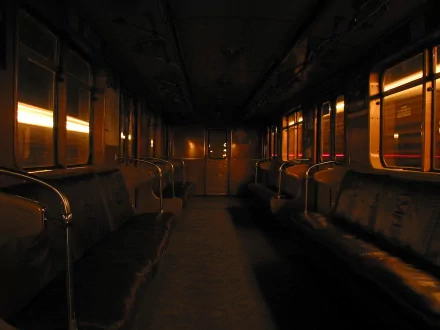 Interior of a dimly lit subway train car captured in HD, creating a moody atmosphere for a PC desktop wallpaper and background.