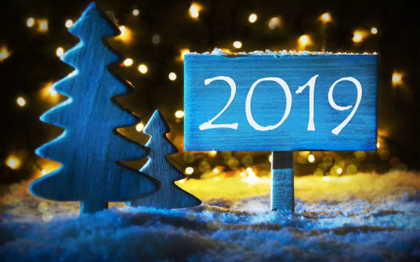 A festive 4K Ultra HD New Year 2019 holiday scene with blue wooden trees and a sign amid sparkling lights and snow, designed as a PC desktop wallpaper background.