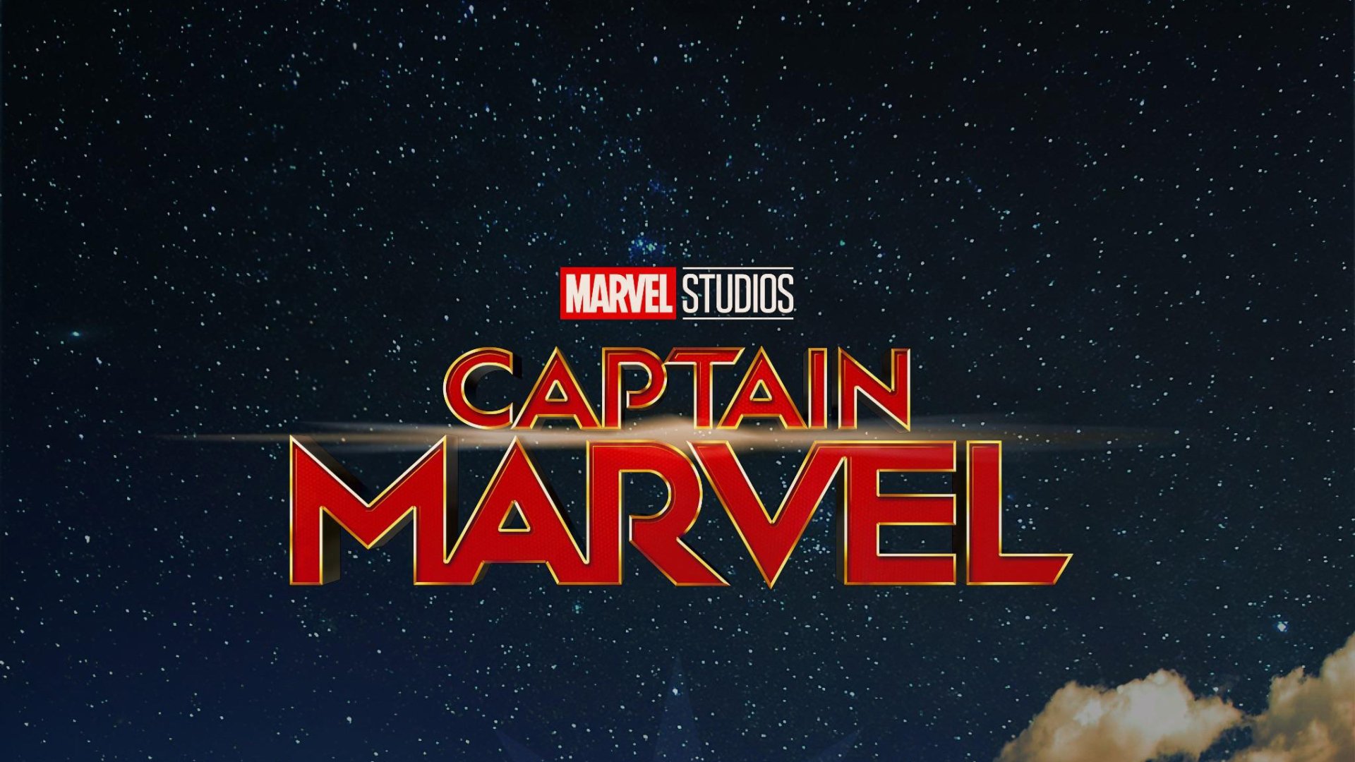 Movie HD PC desktop wallpaper: Marvel Studios' CAPTAIN MARVEL title logo in bold red and gold set against a star-filled night sky.