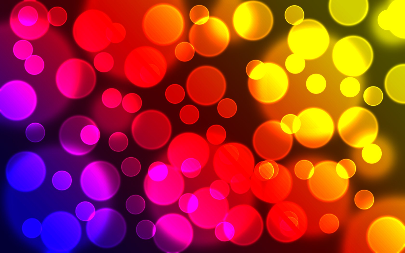 Artistic HD PC desktop wallpaper featuring vibrant multicolored bokeh circles blending from purple and blue to red and yellow.