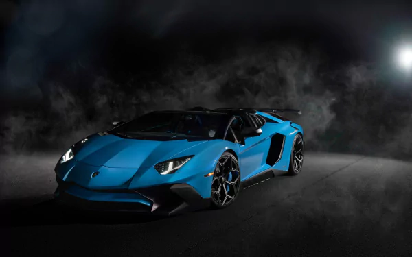 Blue Lamborghini Aventador SV supercar showcased in a dark, smoky setting, captured in high-definition as a striking PC desktop wallpaper background.