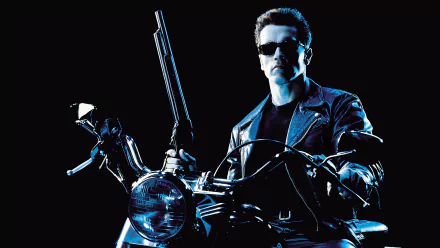 Arnold Schwarzenegger as the Terminator from Terminator 2: Judgment Day, holding a shotgun and sitting on a motorcycle in a 4K Ultra HD desktop wallpaper.
