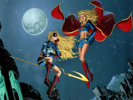 Two iconic DC Comics characters, Stargirl and Supergirl, soar against a night sky with a full moon, showcasing their vibrant costumes and dynamic poses in this HD wallpaper.