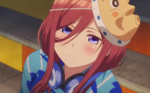 HD desktop wallpaper of Miku Nakano from The Quintessential Quintuplets, featuring her with pink hair, blue eyes, and a blush, wearing headphones.