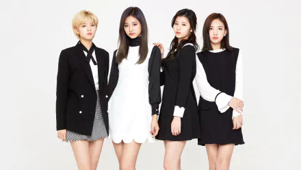 HD PC desktop wallpaper: four K-pop singers in coordinated black-and-white outfits posing against a white backdrop, stylish promotional music group portrait.