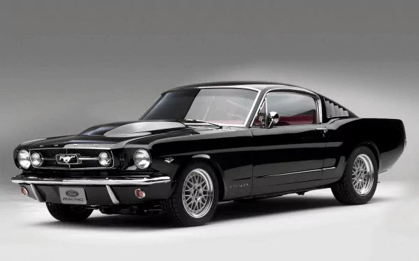 HD desktop wallpaper featuring a sleek black Ford Mustang Fastback, highlighting its classic muscle car design and powerful stance.