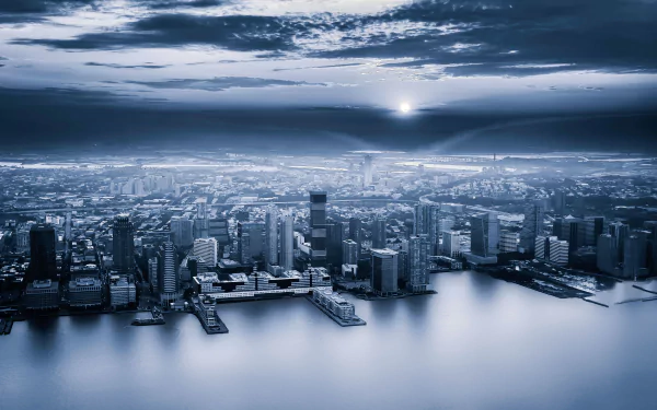 A stunning HD desktop wallpaper showcasing the man-made skyline of Jersey City under a dramatic sky at dusk.