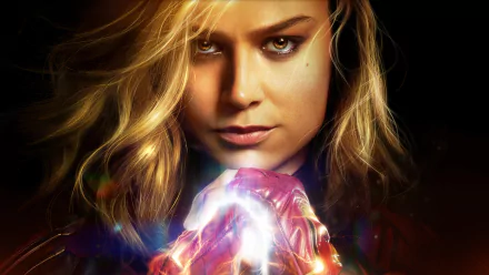HD desktop wallpaper of Brie Larson as Captain Marvel, featuring a close-up image with glowing light effects.